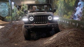 Guests drive a 2018 Jeep Wrangler on a simulated off-road course at the Chicago Auto Show on February 8, 2018, in Chicago, Illinois.