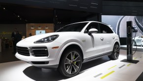 A white 2019 Porsche Cayenne E-Hybrid luxury SUV on display at the 2019 New York International Auto Show on Thursday, April 18, 2019