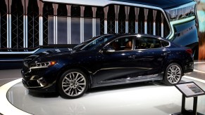 A 2020 Kia Cadenza sits on display at an auto show