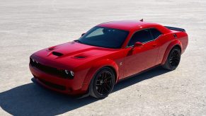 A red 2021 Dodge Challenger R/T Scat Pack Widebody parked on display