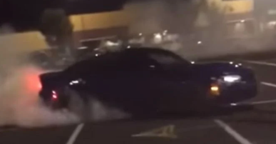 2021 Dodge Charger Hellcat Widebody Redeye doing donuts in parking lot