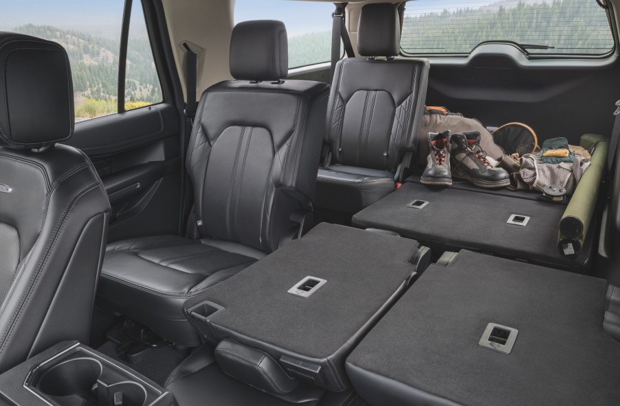 A 2021 Ford Expedition Platinum full-size SUV's black-leather rear seating and cargo space