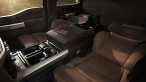 A 2021 Ford F-150 King Ranch pickup truck's tan front seats reclined flat