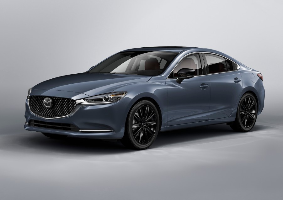 A 2021 Mazda6 Carbon Edition midsize sedan with black wheels, a black grille, and gray metallic body paint