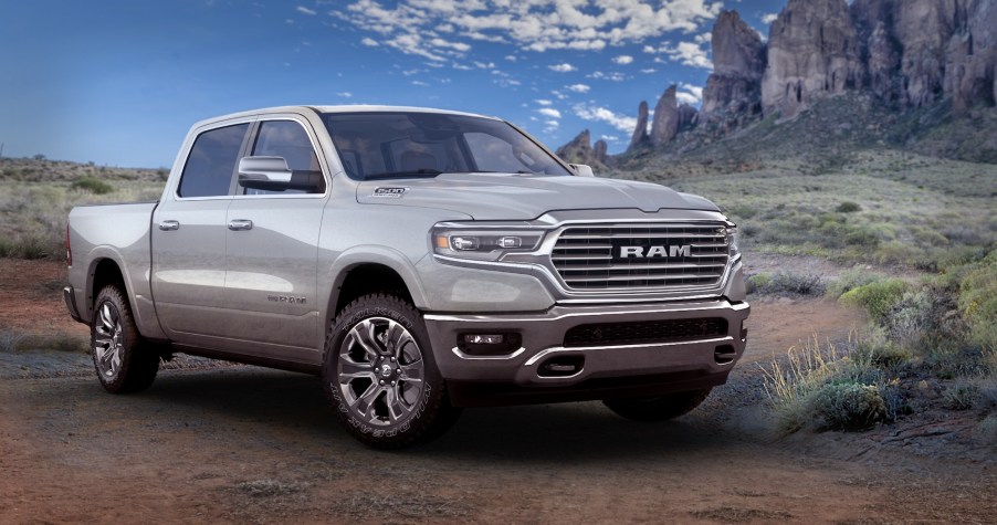 A silver 2021 Ram 1500 Limited Longhorn 10th Anniversary Edition pickup truck parked in a desert