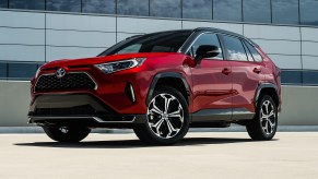 The 2021 Toyota RAV4 Prime parked near a building