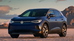 A dark-blue 2021 Volkswagen ID.4 at the Bonneville Salt Flats at sunset