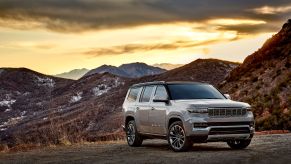 A white 2022 Jeep Grand Wagoneer Series III parked by a desert mountain range