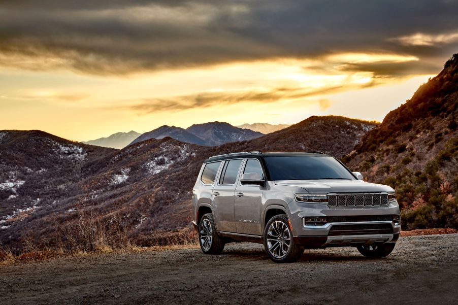 A white 2022 Jeep Grand Wagoneer Series III parked by a desert mountain range