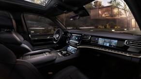 A Jeep Grand Wagoneer concept's interior front seats and dashboard