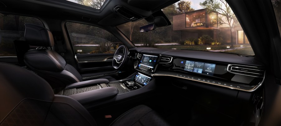 A Jeep Grand Wagoneer concept's interior front seats and dashboard