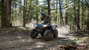 a 2021 Polaris Sporstman XP 1000 ATV in the forest