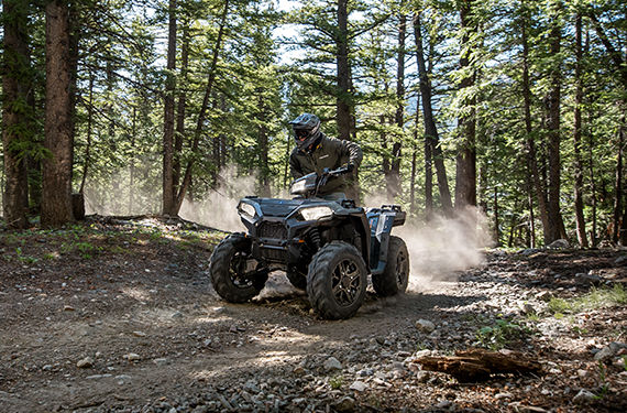 a 2021 Polaris Sporstman XP 1000 ATV in the forest