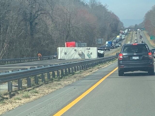 An RV on it's side blocking I-40 traffic 