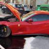 A wrecked Wrecked Ferrari 812 Superfast on the street