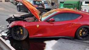 A wrecked Wrecked Ferrari 812 Superfast on the street