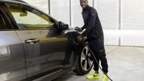 Vinícius Júnior stands next to his new Audi