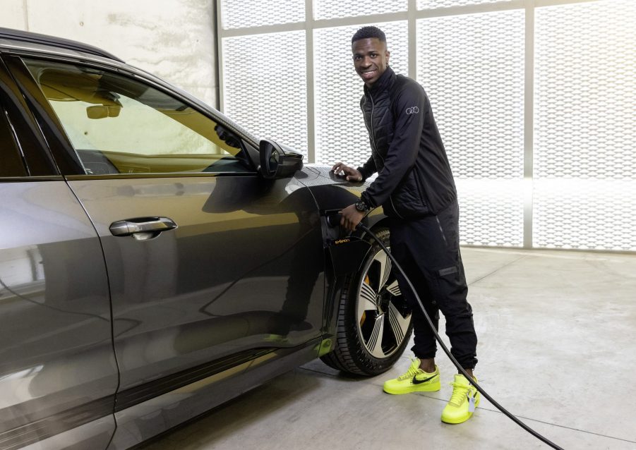 Vinícius Júnior stands next to his new Audi