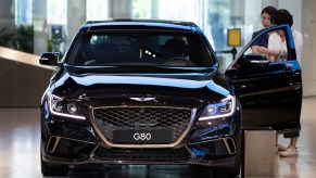 A Genesis G80 on display in a showroom