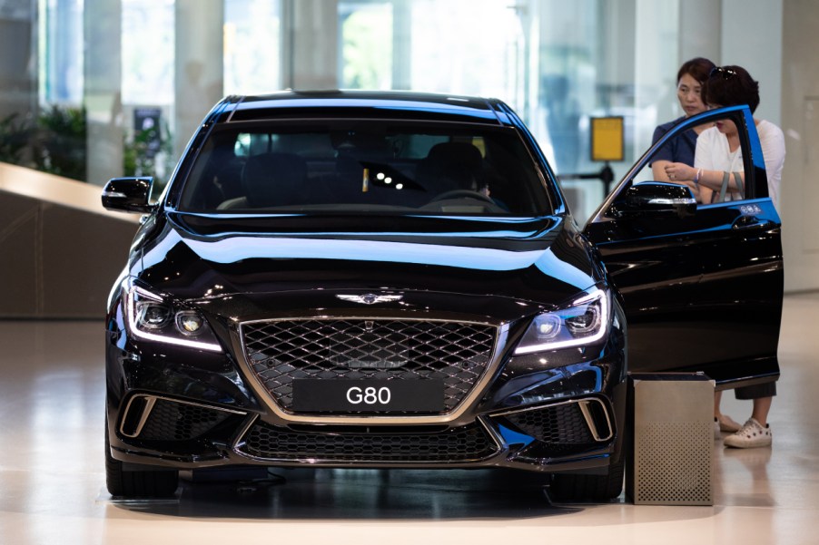 A Genesis G80 on display in a showroom