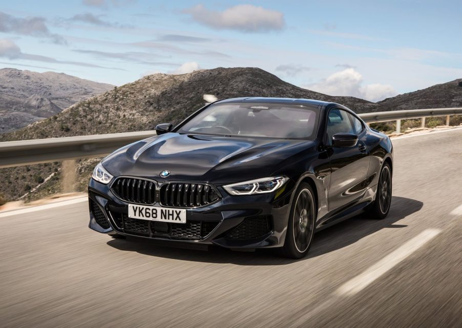 A black BMW 8-Series outdoors on the road.