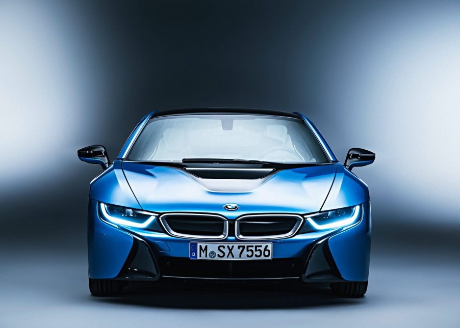 An image of a blue BMW i8 photographed inside of a studio.