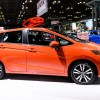 An orange 2016 Honda Fit sits on display