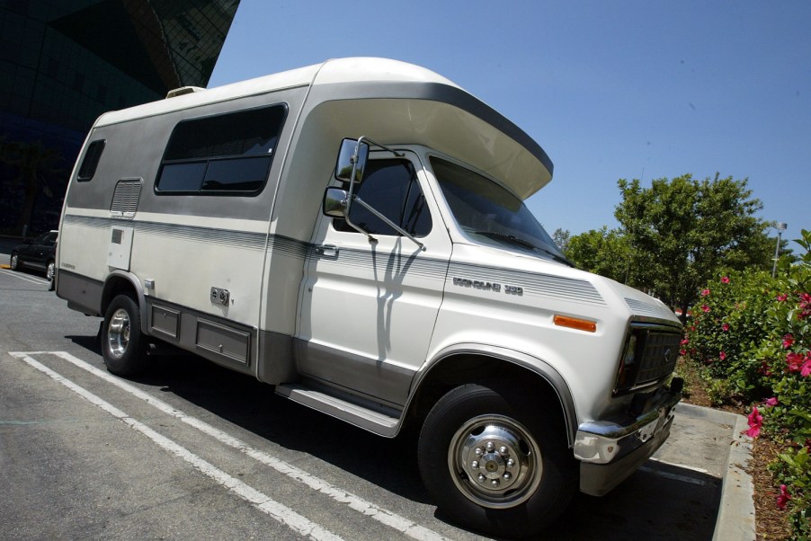 An RV in a parking lot waiting for a new adventure