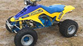 the legendary quadzilla suzuki LT500 parked in the mud