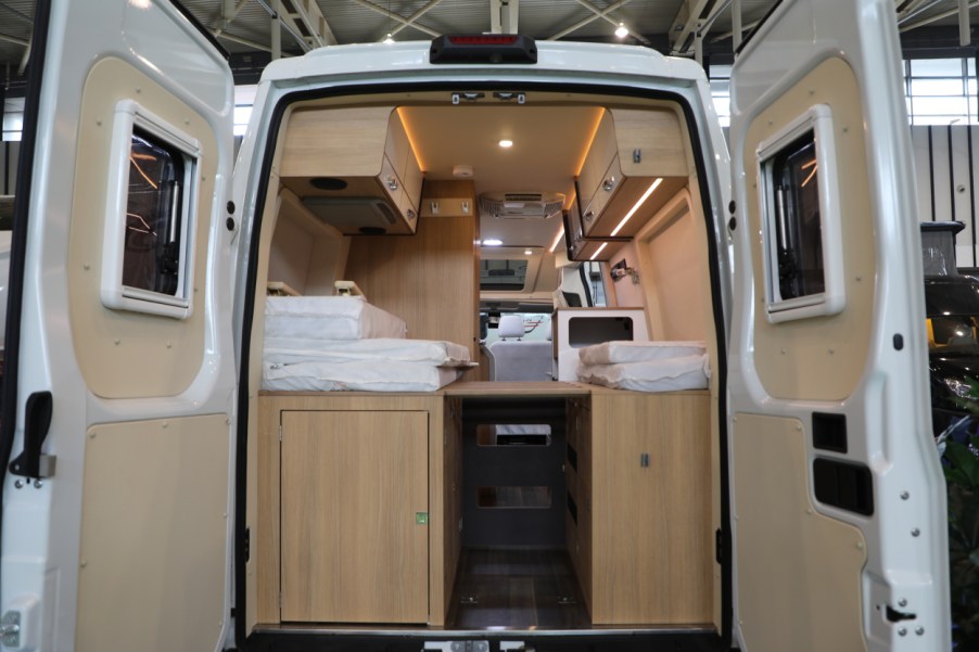 The rear entrance of a camper van on display