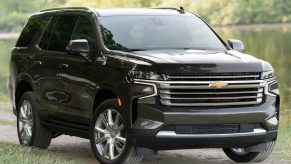 An image of a brown Chevrolet Tahoe parked outside.