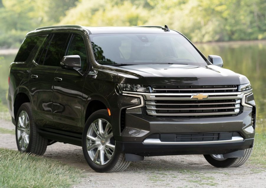 An image of a brown Chevrolet Tahoe parked outside.