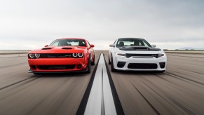 An image of a Dodge Challenger and Charger out on an airfield.