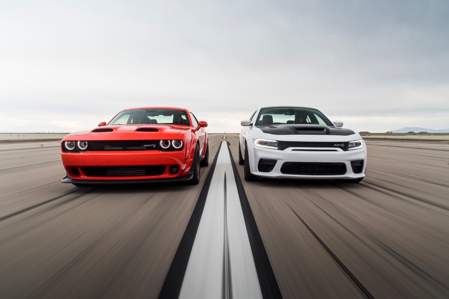 An image of a Dodge Challenger and Charger out on an airfield.