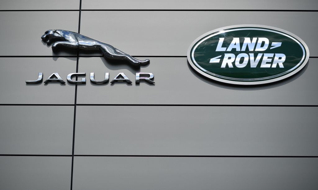 Jaguar and Land Rover logos on the external wall of a JLR dealership