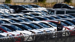 Nissan sedans and other cars stacked up for shipment