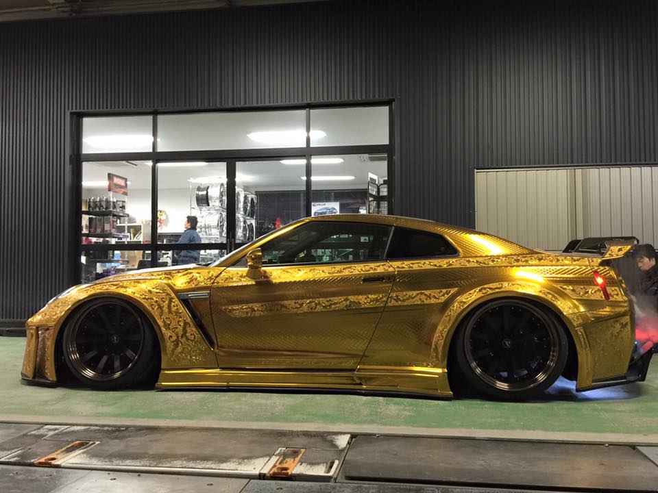 side view ofKuhl Racing gold chrome engraved Nissan GT-R