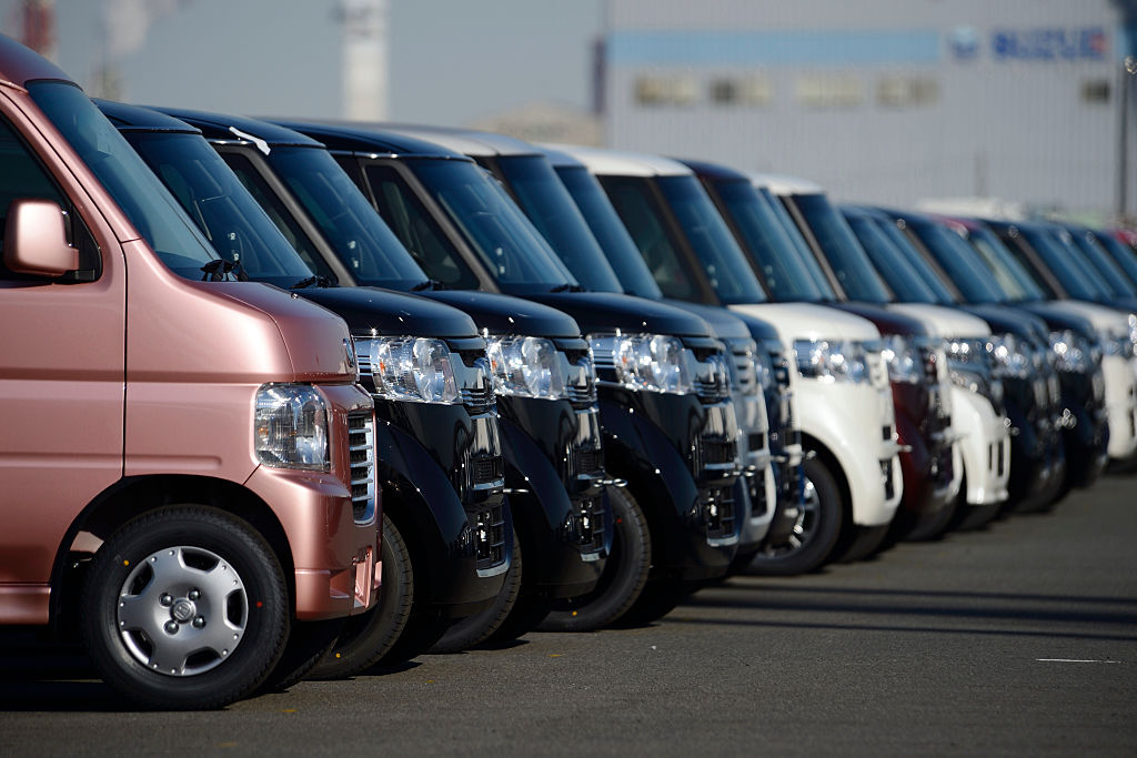 lineup of Japanese vans at port in Japan