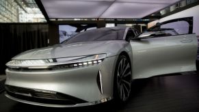 A silver Lucid Air luxury EV on display