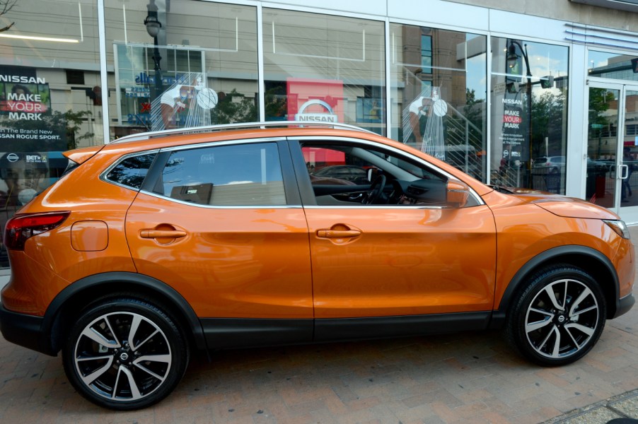 An orange Nissan Rogue on display