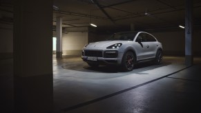 white 2021 Porsche Cayenne GTS in a fancy garage