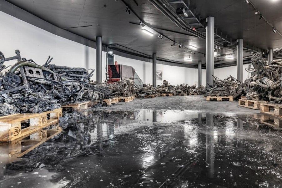 Part of the remnants from the Top Point Motorcycle Museum's burned collection on pallets