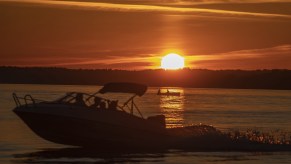 A boat on the water during sunset