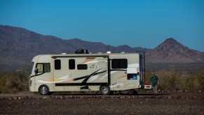 Paul Ostrom, age 67, of Sandpoint, Idaho, walks outside his RV, parked at the La Posa long-term visitor area in Quartzsite, Arizona