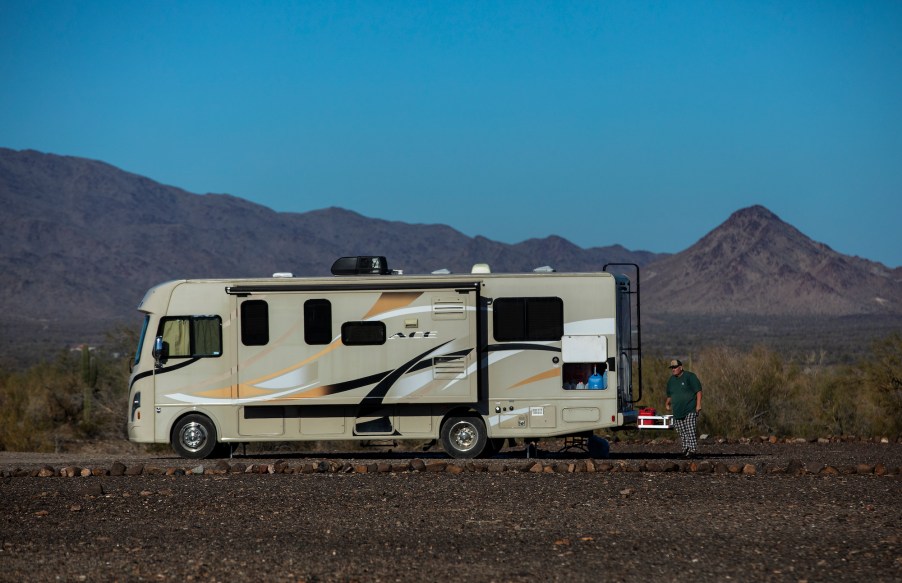 Paul Ostrom, age 67, of Sandpoint, Idaho, walks outside his RV, parked at the La Posa long-term visitor area in Quartzsite, Arizona