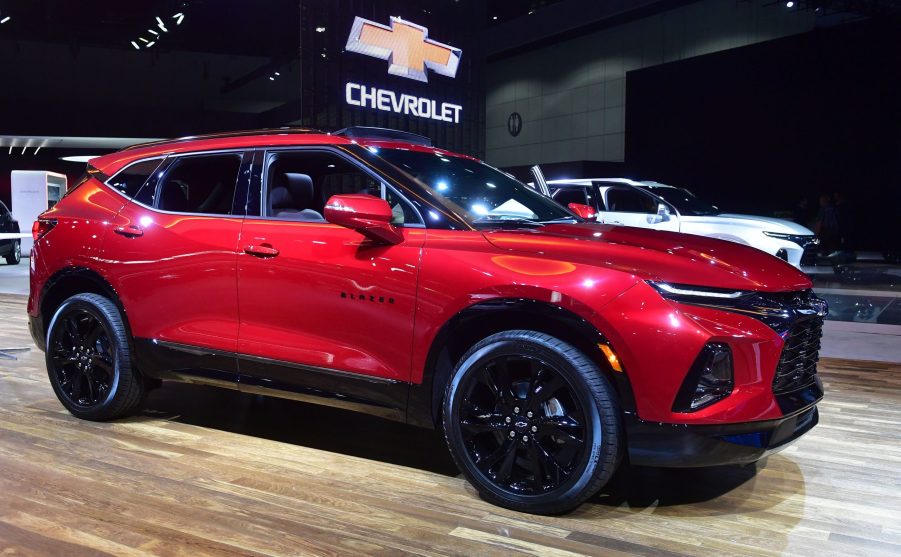 A red Chevy Blazer on display at an auto show