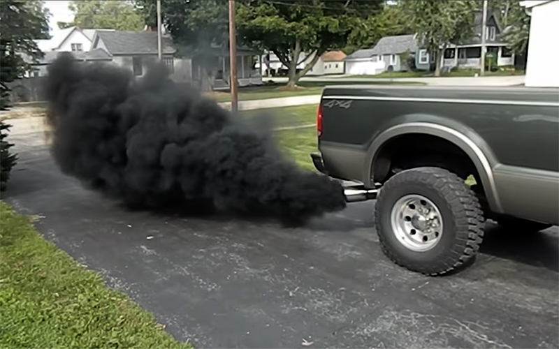 Pickup truck rolling coal