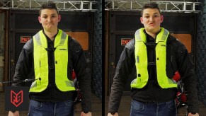 Ryan from FortNine demonstrating the bright-green Helite Turtle 2 airbag vest