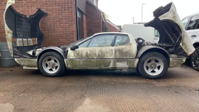 An image of a Ferrari 512 BBi parked outside.