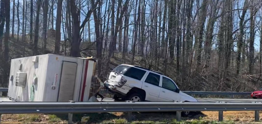 A wrecked RV and Chevy Trailblazer blocking I-40